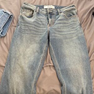 blue wash low rise relaxed straight leg jeans.